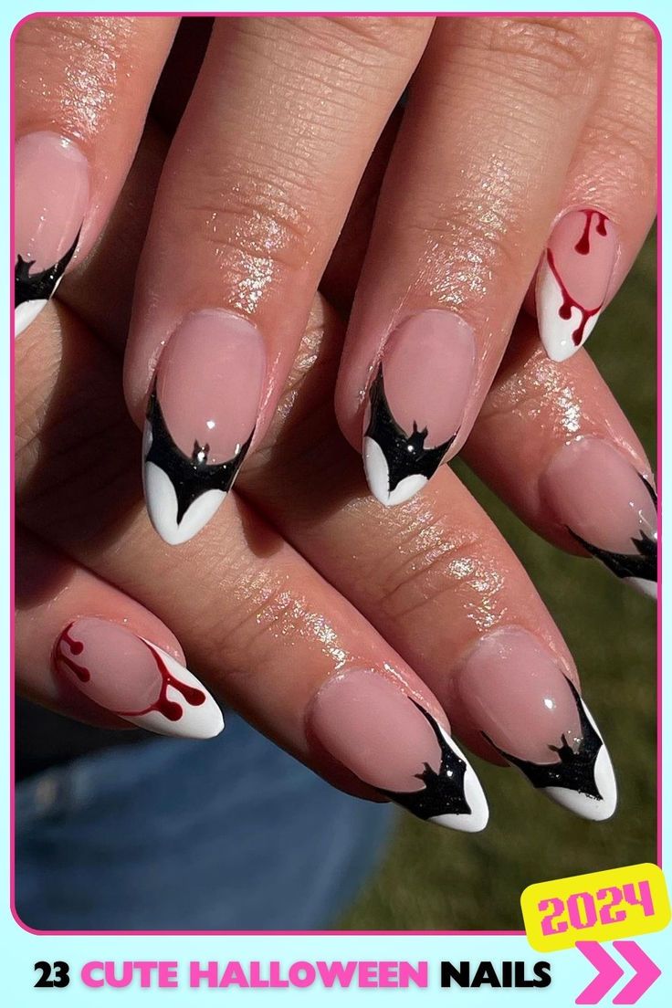 Spooky Halloween Nail Design with Bat Wing Tips and Dripping Blood Accents