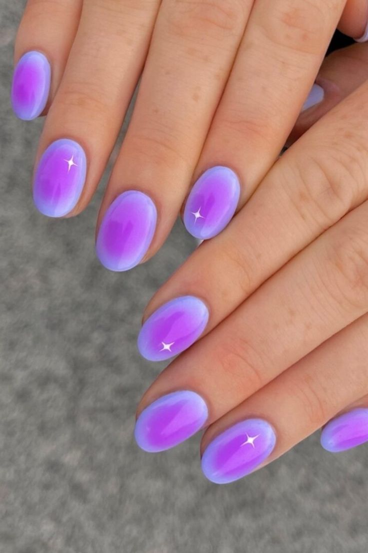 Dreamy Ombre Nails: Soft Purple Gradient with Whimsical Star Accents.