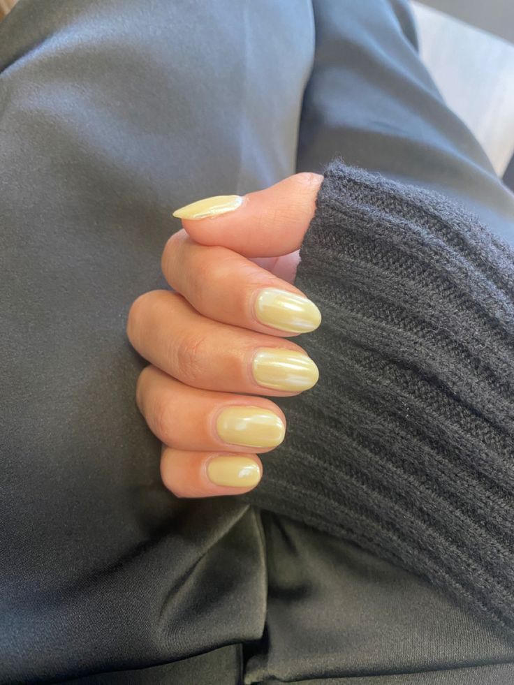 Elegant Oval Yellow Nail Design: A Fresh Blend of Simplicity and Sophistication.