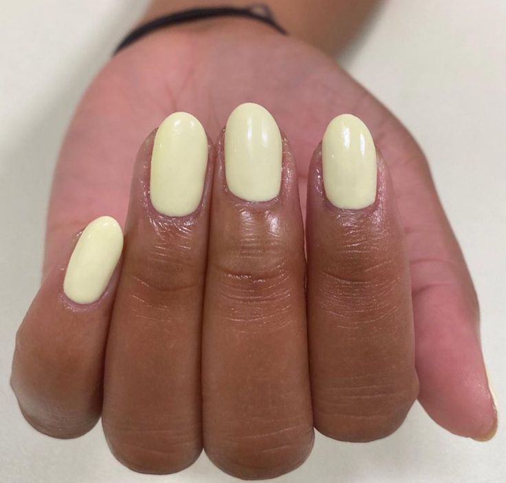 Elegant Soft Lemon Yellow Oval Nail Design for Any Occasion