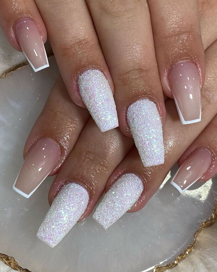 Elegant Glitter Ombre French Nail Design with Soft Pink and Iridescent Accents