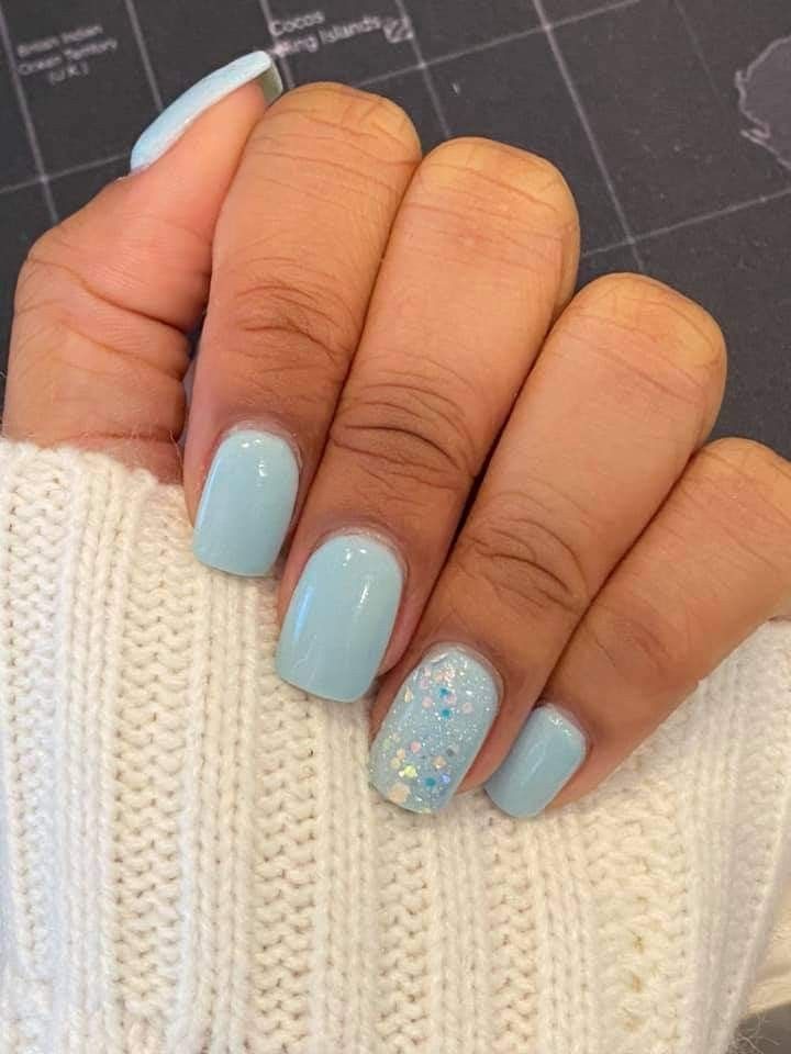 Chic Pastel Blue Nail Design with Elegant Glitter Accent.