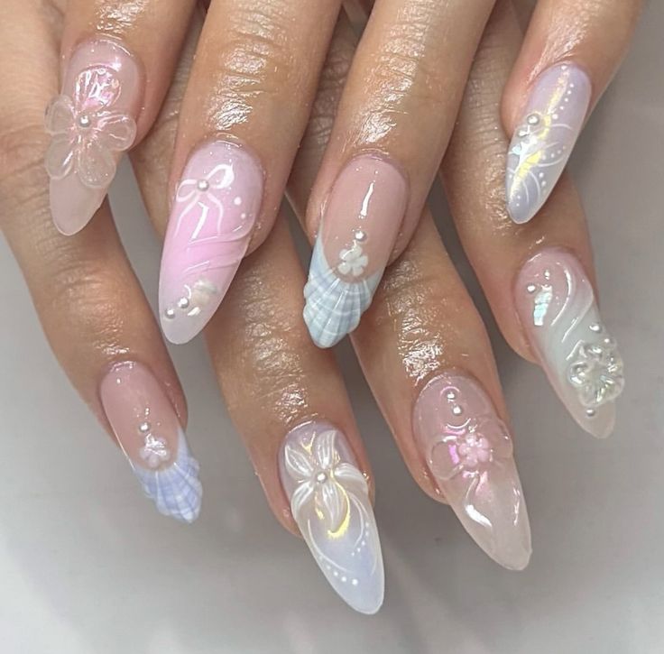 Chic Pastel Nail Design with Intricate Floral Patterns and Elegant Finishes