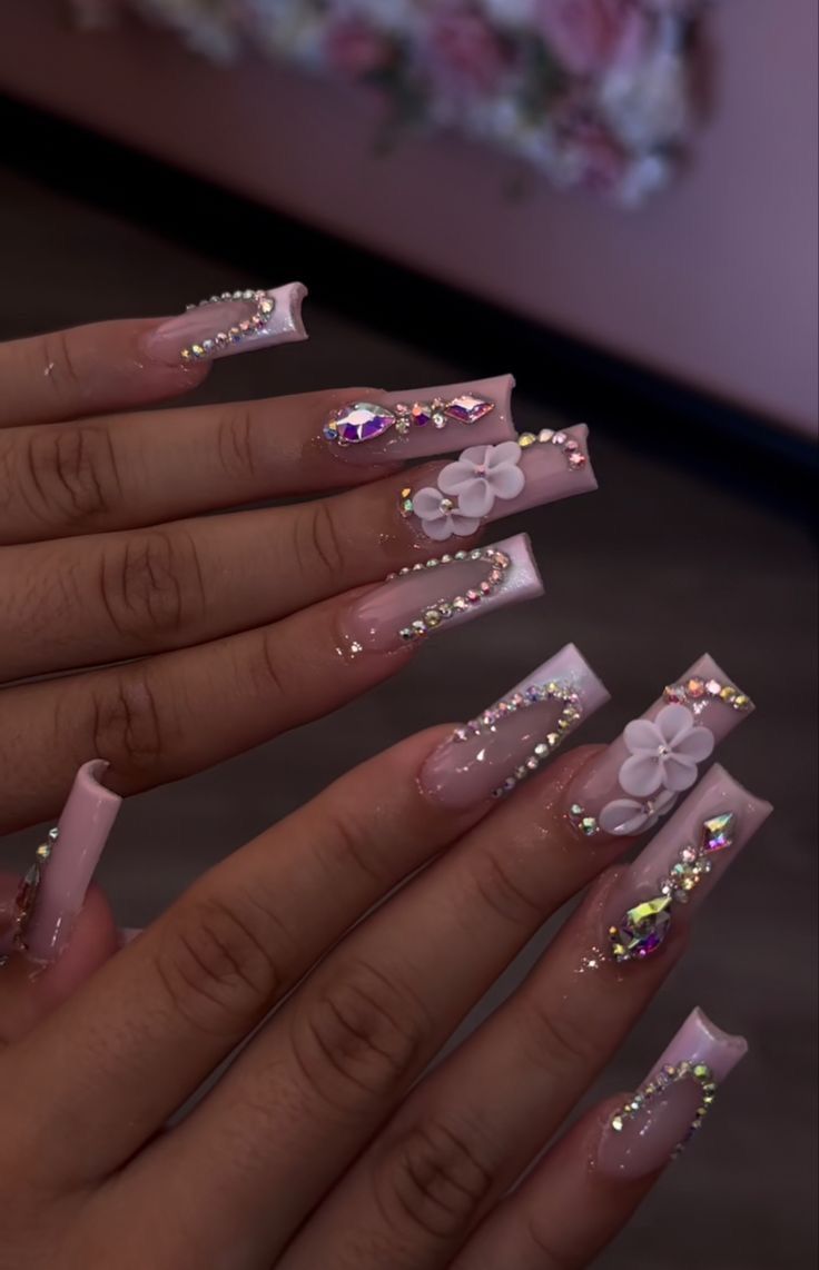 Luxurious Pastel Pink Coffin Nails with Floral Accents and Rhinestones