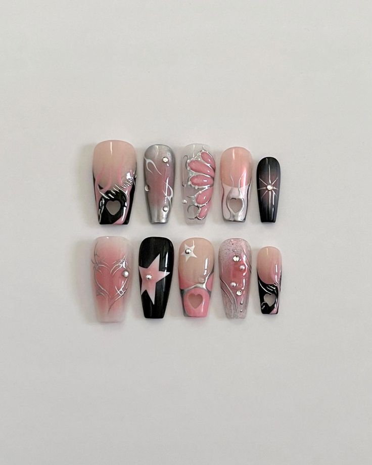 Chic Nail Art: Soft Pinks and Bold Blacks with Playful Patterns.