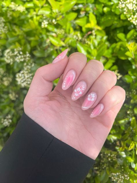 Charming Soft Pink Nail Design with Floral Accents and Pearls for Spring Elegance