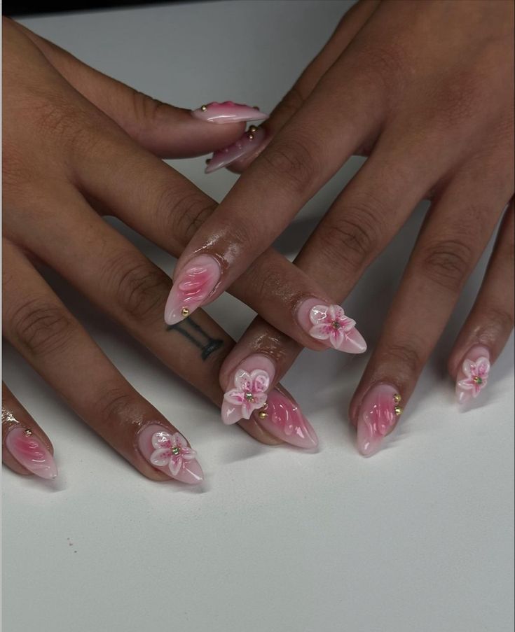 Elegant Floral Nail Design with Soft Pink Shades and Delicate Accents