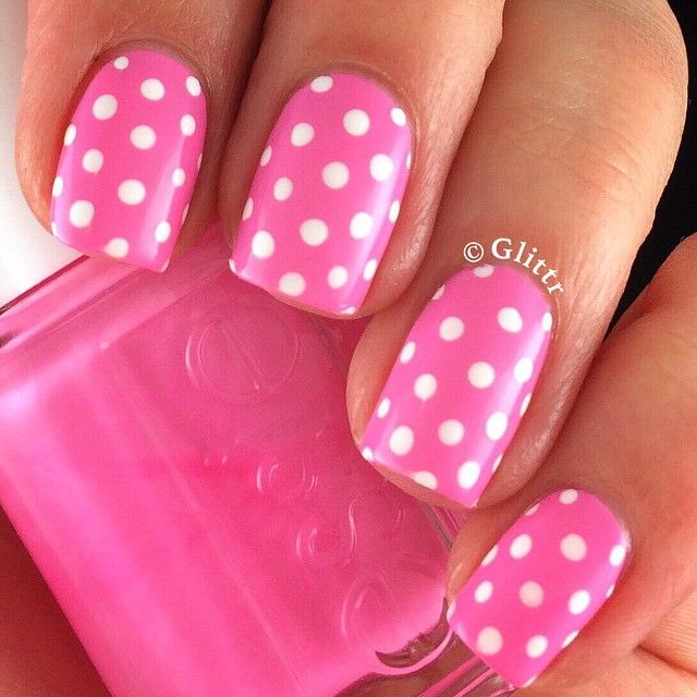 Vibrant Pink Polka Dot Nail Design for a Cheerful Summer Aesthetic.