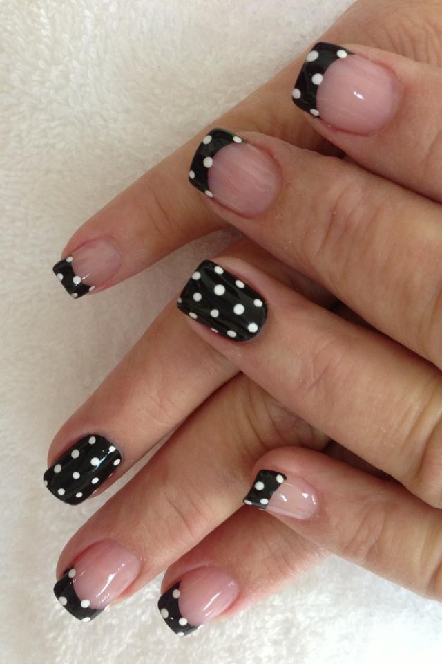 Chic Black Polka Dot Nail Design with Playful French Tips in Alternating Shades.