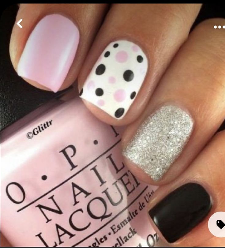 Playful Textured Nail Design with Pink Base, Polka Dots, Glitter, and Sleek Black Finish.