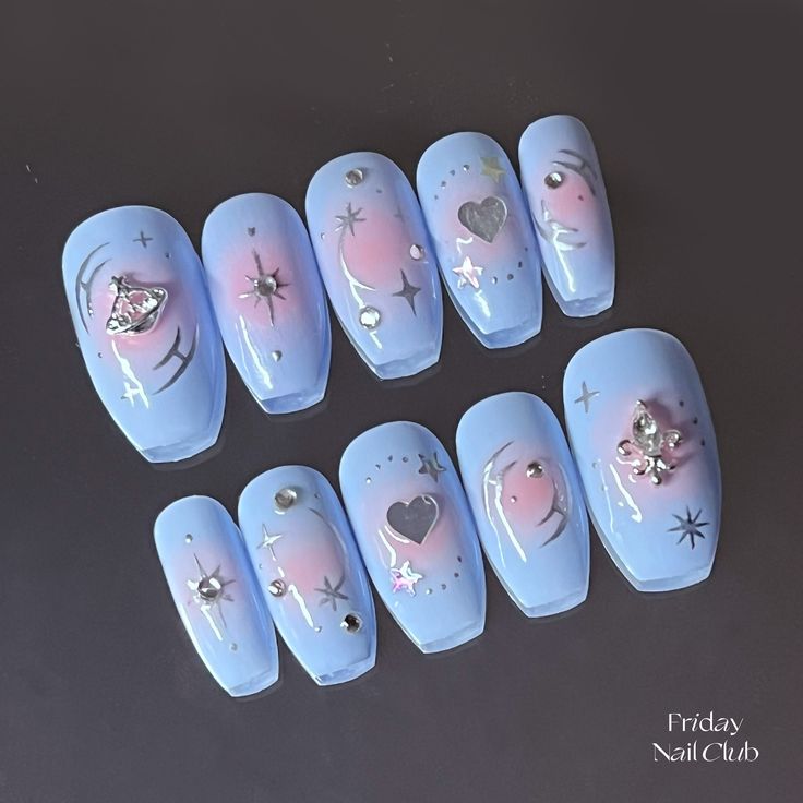 Celestial-Inspired Dreamy Blue and Pink Gradient Nail Design with Silver and Rhinestone Accents.