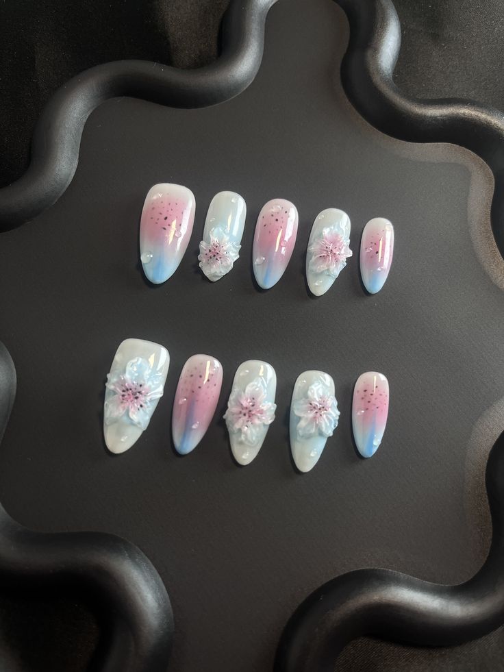 Elegant Spring Ombre Nail Design with Pastel Floral Accents.