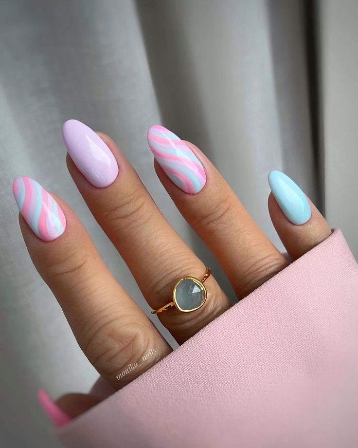 Chic Pastel Nail Design with Striped Patterns and Almond Tips.