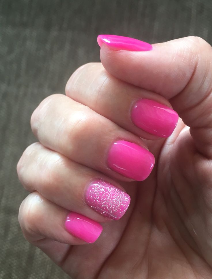 Chic Vibrant Pink Nail Design with Glossy Finish and Sparkle Accents