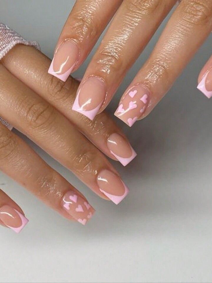 Elegant Nail Art: Chic Nude Base with Pink Accents and Romantic Heart Motifs.