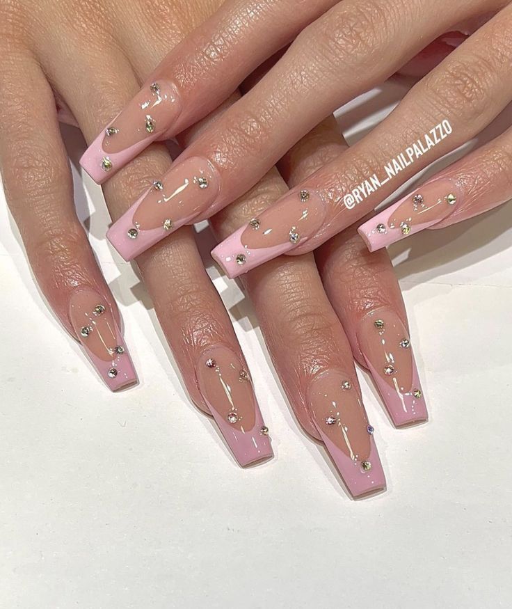 Sophisticated Elegant Pink Nail Design with Clear Accents and Silver Embellishments.