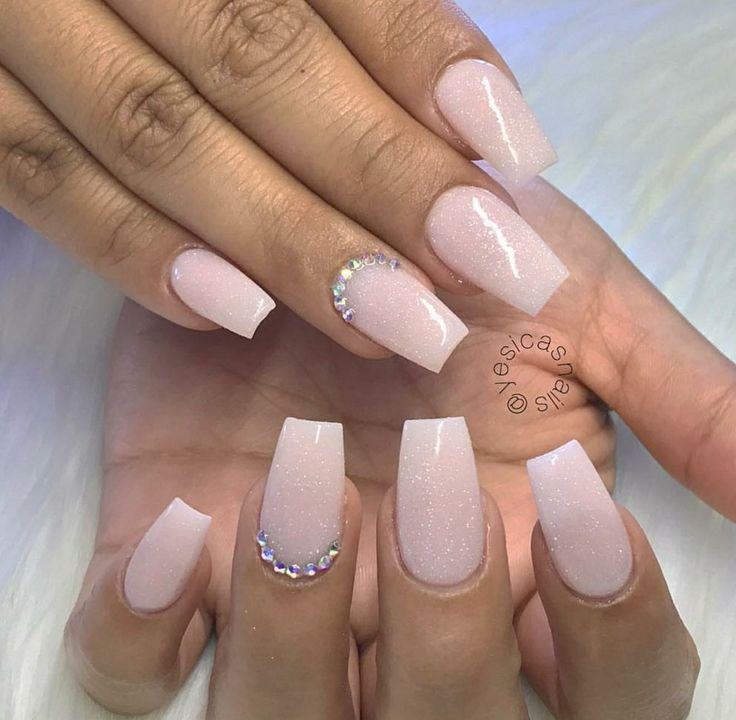 Elegant Soft Pink Nail Design with Shimmer and Sparkling Gem Accent