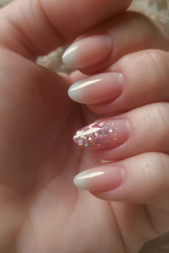 Elegant Ombre Nail Design with Holographic Glitter Accent for a Glamorous Touch.