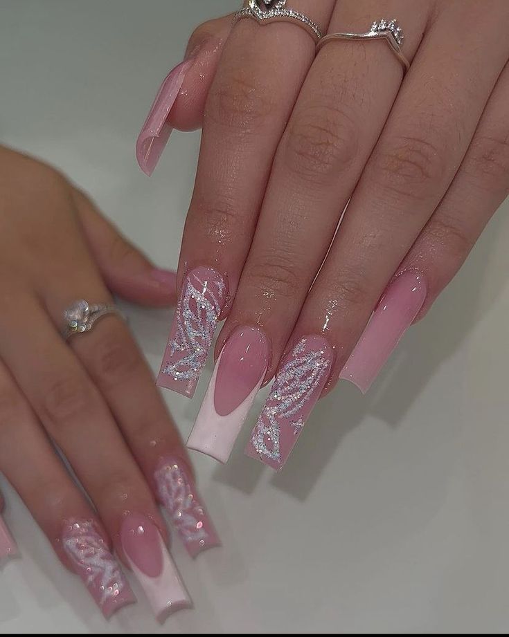 Elegant Ombre Nail Design with Pink, White, and Intricate Silver Detailing