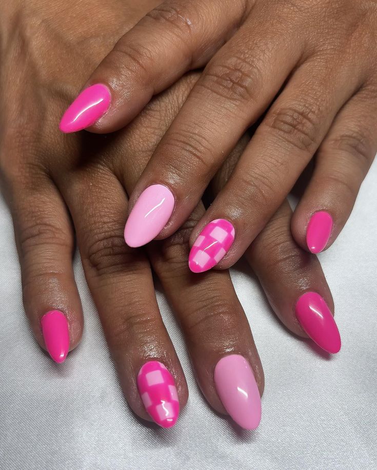 Chic Vibrant Pink Nail Design with Glossy Finishes and Unique Patterns