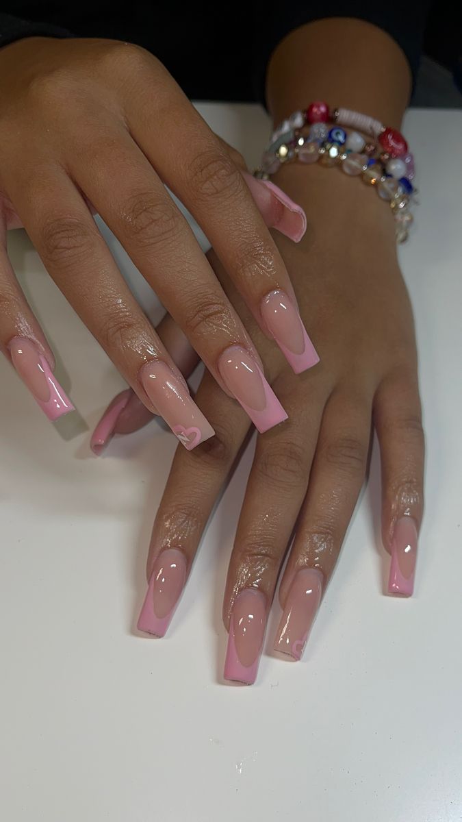 Elegant Ombre Long Nails: A Sophisticated Blend of Nude and Pink with Glossy Finish.