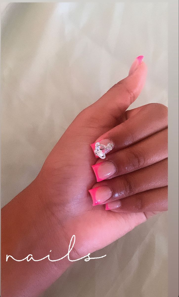 Chic Vibrant Nail Design: Pink and Nude with Heart-Shaped Rhinestone Accent.