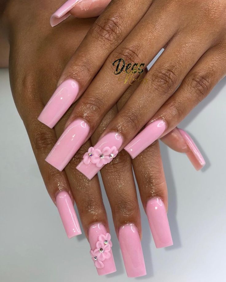 Elegant Glossy Pink Nail Design with Playful Floral Accents