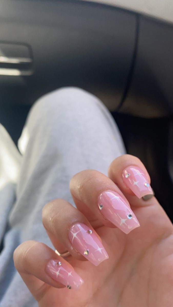 Chic Long Pink Nails with Glossy Finish and Elegant Rhinestones.