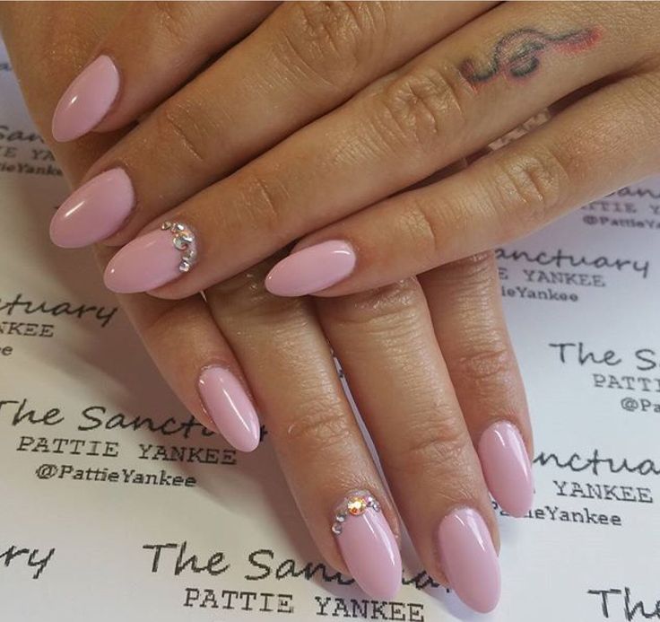 Chic Almond Pink Nails Enhanced with Glamorous Rhinestones