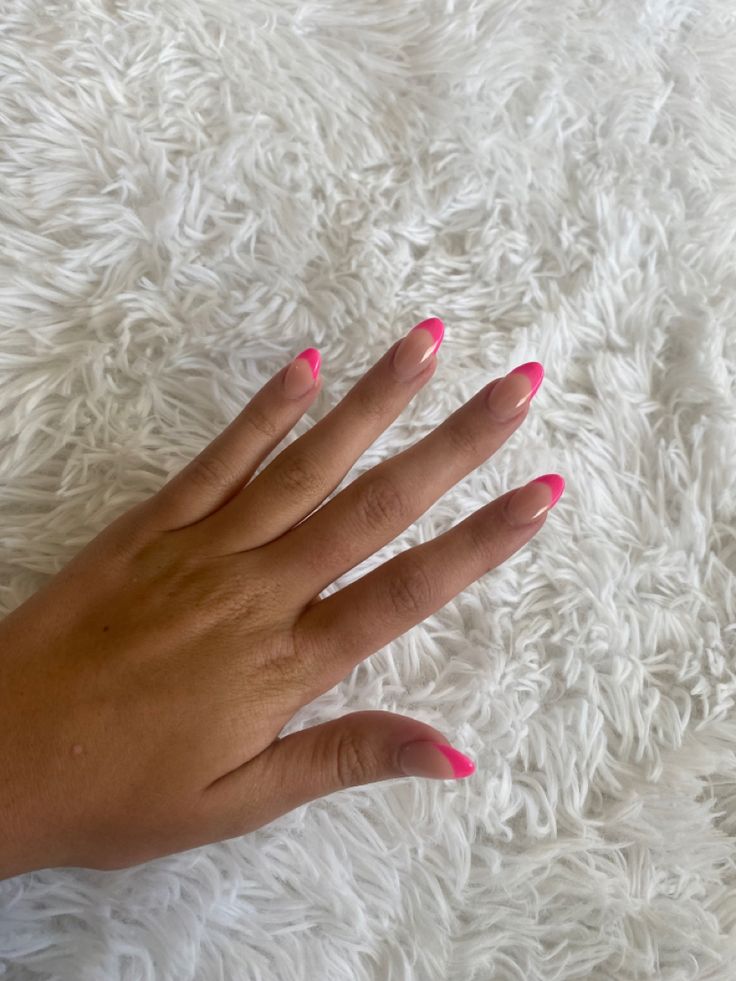 Playful Nail Design: Neon Pink Tips on a Nude Base for a Trendy Summer Look.