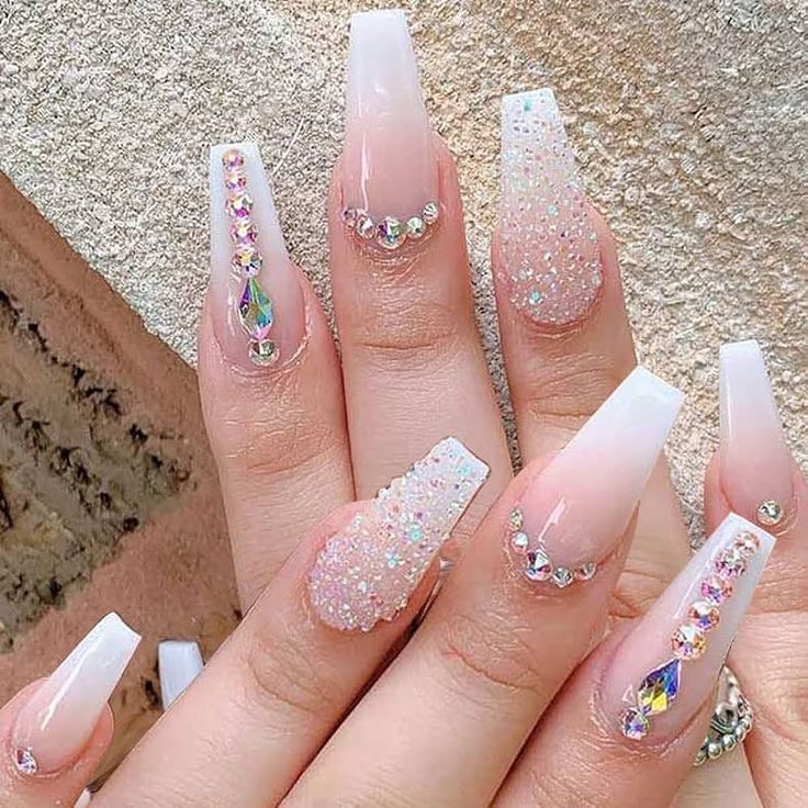 Sophisticated Ombre and Glitter Nail Design with Rhinestones for Glamorous Occasions.