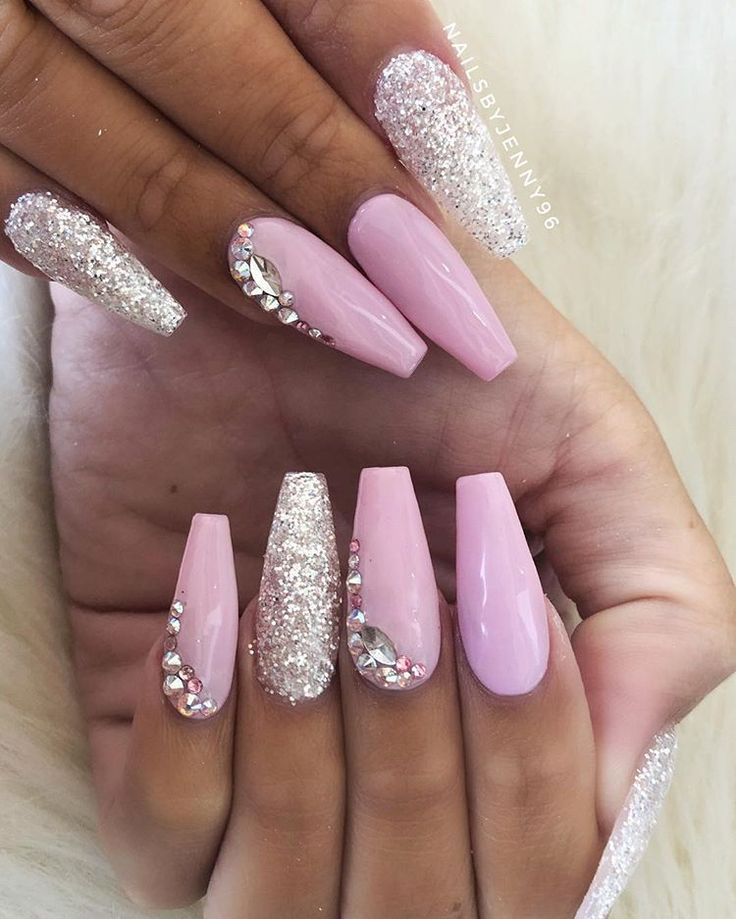 Chic Stiletto Nail Design: Soft Pink and Sparkling Silver Elegance with Glitter and Rhinestones.