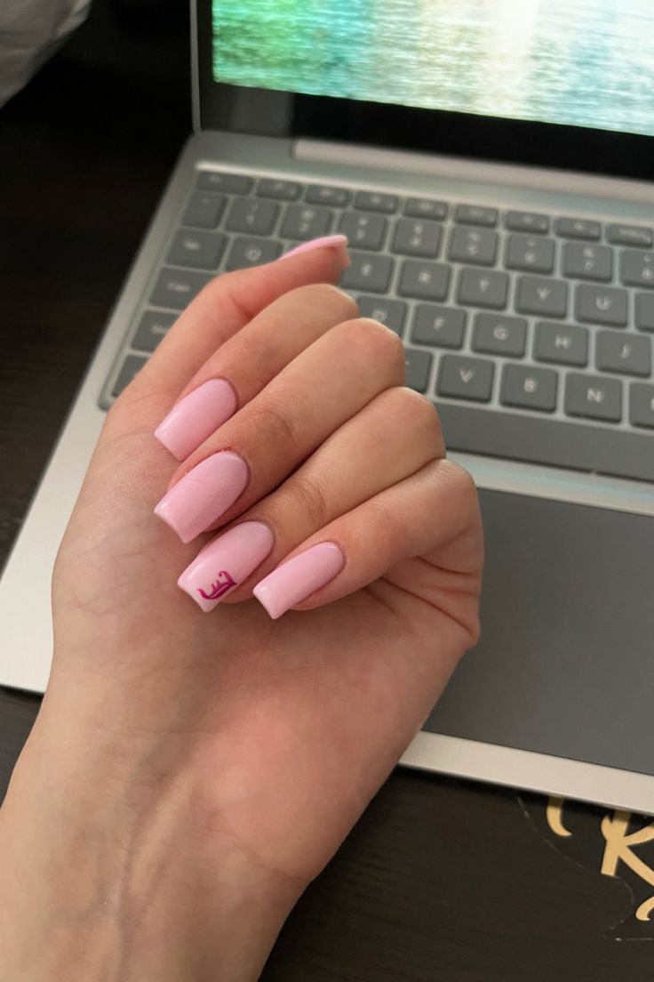 Soft and Feminine Elegant Pink Nails with Glossy Finish and Unique Design.