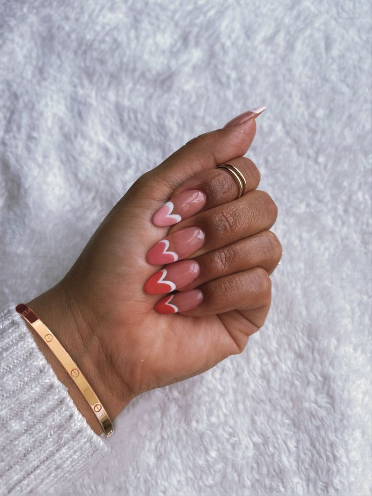 Charming Romantic Nail Design with Soft Pinks, Rich Coral, and Heart-Shaped Tips.