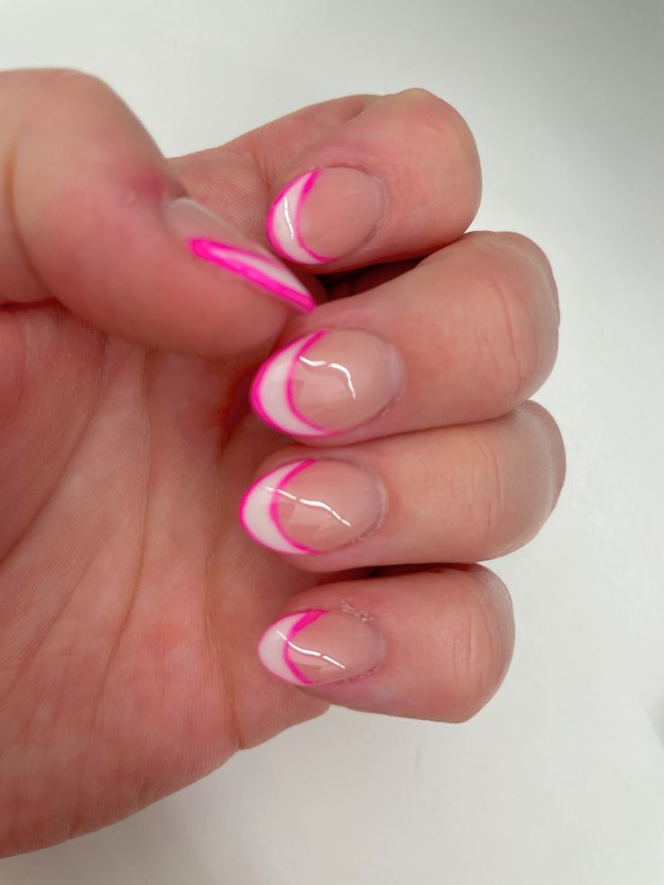 Chic French Tip Nail Design with Bold Pink Accents for a Vibrant Flair.