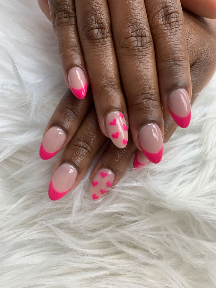 Charming Playful Nail Design: Elegant French Tips with Whimsical Pink Hearts.