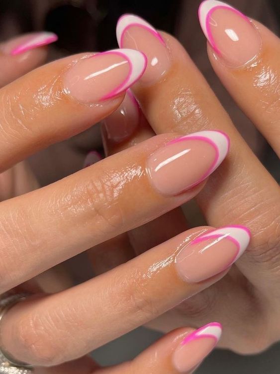 Chic French Tip Nail Design with Vibrant Pink Accents.