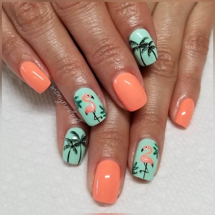 Vibrant Tropical Nail Design with Playful Flamingos and Palm Trees.