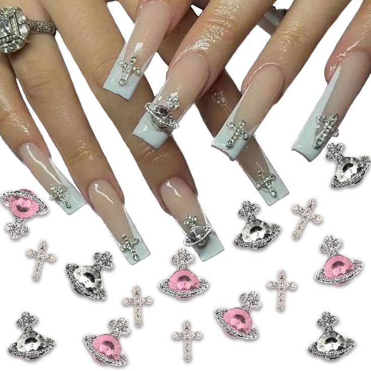 Glamorous Ombre Nail Design with Silver and Pink Rhinestones and Charming Motifs.