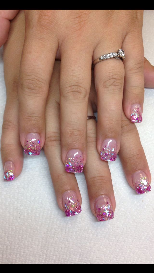 Elegant Pink Gradient Nail Design with Shimmering Glitter and Iridescent Tips.