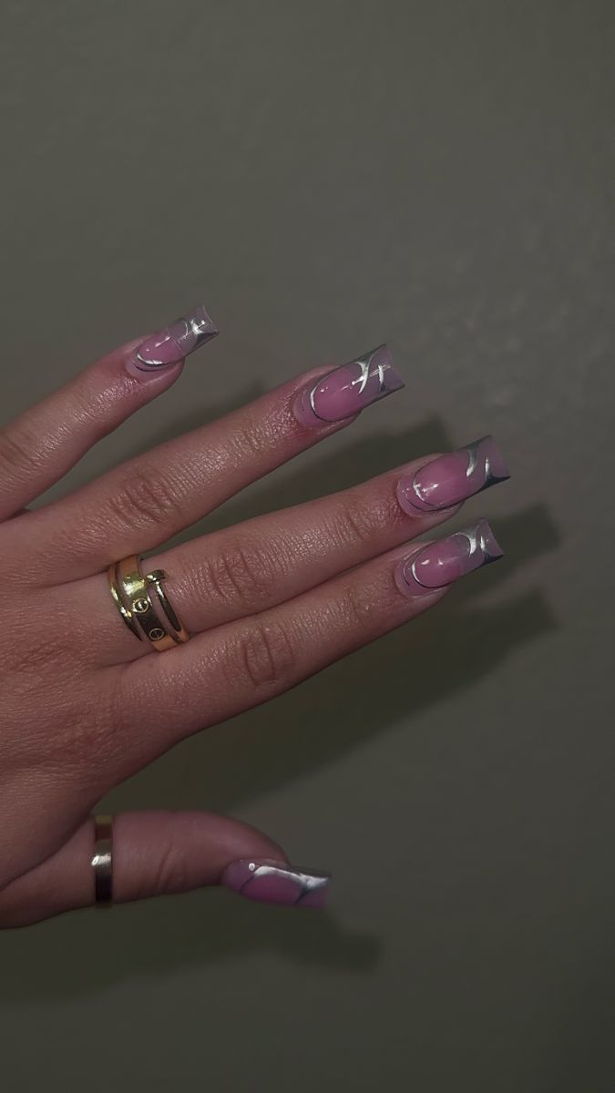 Sophisticated French Tip Nail Design with Artistic Swirls and Glossy Finish.