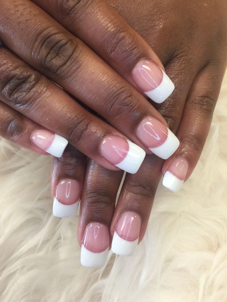 Timeless Elegance: The Classic French Manicure in Soft Pink and White.