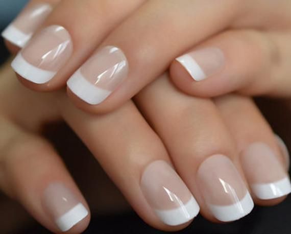 Timeless Elegance: Classic French Manicure with Subtle Pink Base and Crisp White Tips.