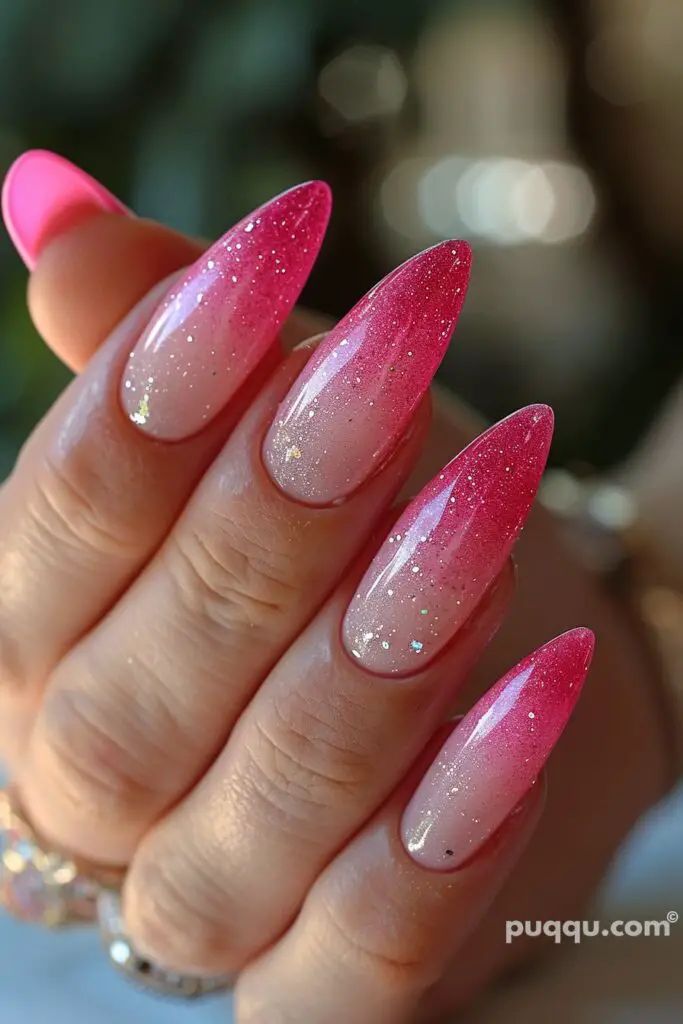 Elegant Ombre Nail Design: Soft to Bright Pink Gradient with Glamorous Glitter Accents