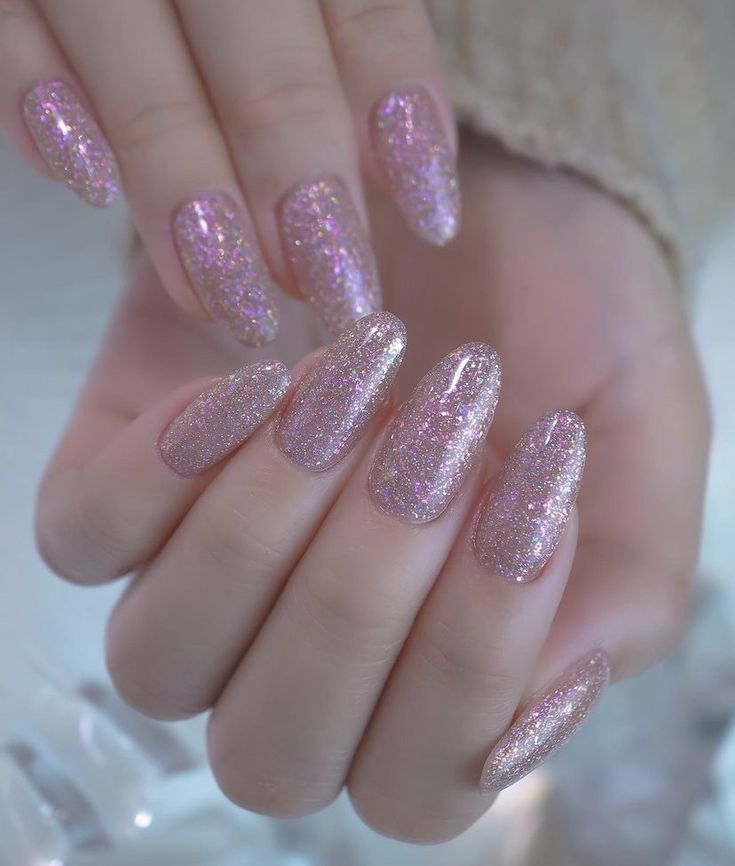 Elegant Glittering Pink Nails: Chic Multi-Dimensional Sparkle for Any Occasion.