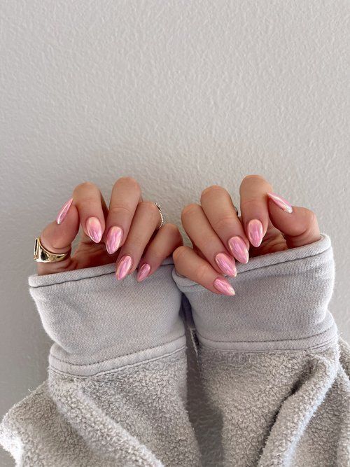 Sophisticated Almond-Shaped Nails with Glossy Soft Pink Finish and Elegant Accent Details.