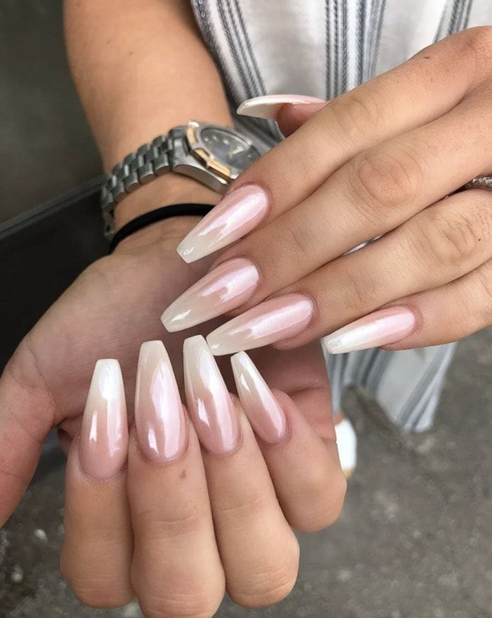 Chic Gradient Long Nails: Pink-White Ombre with Glossy Finish and Edgy Pointed Shape.