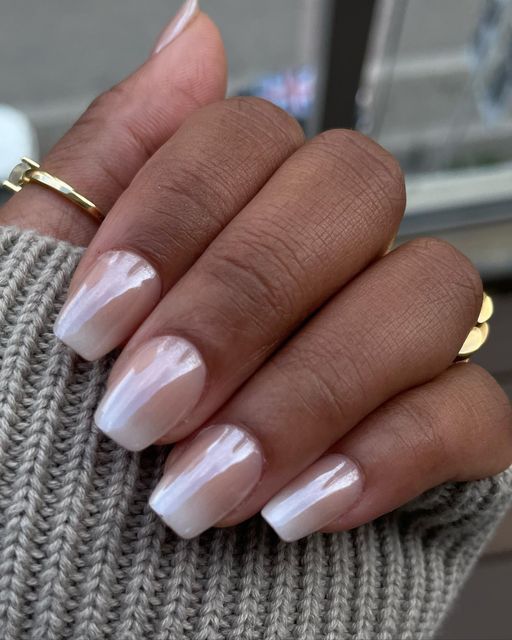 Sophisticated Ombre Gradient Nail Design with Glossy Tips and Delicate Ring Accents.