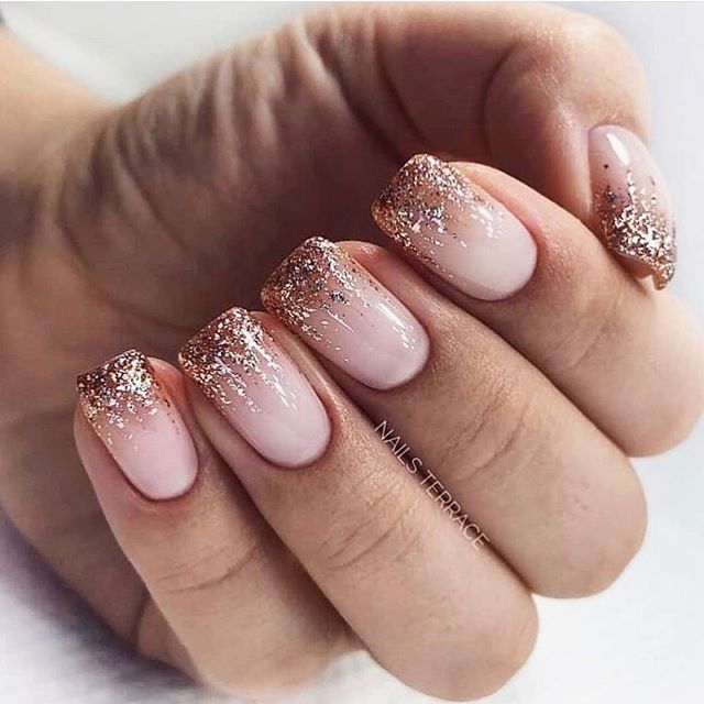 Chic Gradient Nail Design: Soft Nude Base with Sparkling Gold Glitter Tips