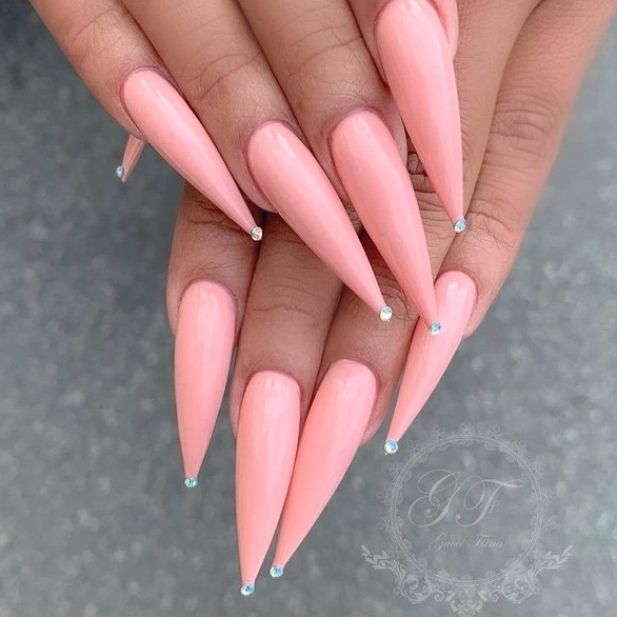 Chic Soft Peach Stiletto Nails with Glossy Finish and Sparkling Rhinestones.